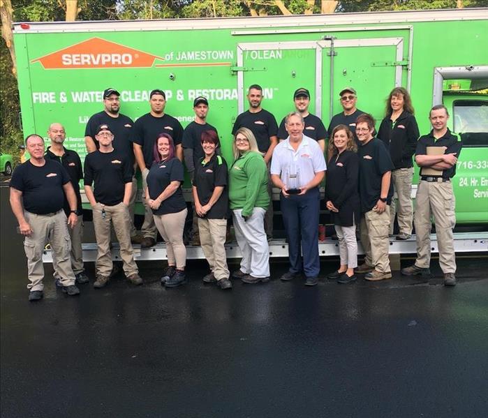 SERVPRO crew standing in front of their truck
