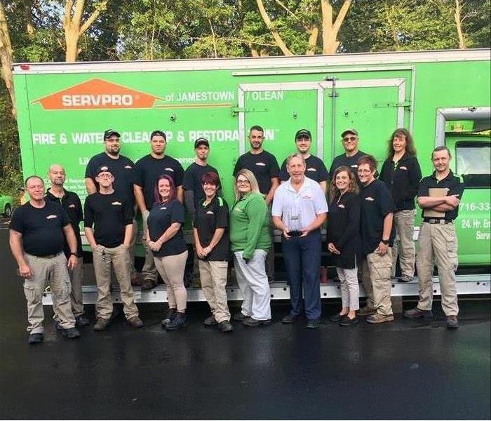 SERVPRO Technicians lined up for photo with SERVPRO Truck